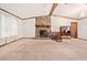 Spacious living room with a stone fireplace, bright natural light, and wood trim at 1184 Alemeda Dr, Marietta, GA 30066