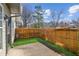 Cozy backyard with well-maintained fence, artificial grass, and stone patio at 1921 Harrison Park Dr, Atlanta, GA 30341