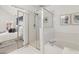 Bright bathroom features a glass shower and a soaking tub at 1921 Harrison Park Dr, Atlanta, GA 30341