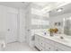 Elegant bathroom boasts a dual vanity, neutral paint, and shower with glass door at 1921 Harrison Park Dr, Atlanta, GA 30341