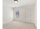 Well-lit bedroom includes plush carpet, closet and window at 1921 Harrison Park Dr, Atlanta, GA 30341
