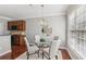 Cozy dining area with modern chandelier, and lots of natural light at 1921 Harrison Park Dr, Atlanta, GA 30341