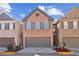 Charming brick townhome featuring a two-car garage and well-maintained landscaping at 1921 Harrison Park Dr, Atlanta, GA 30341