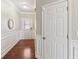 Inviting hallway featuring hardwood floors and classic white wainscoting at 1921 Harrison Park Dr, Atlanta, GA 30341