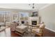 Bright living room featuring a fireplace, large windows, and elegant decor at 1921 Harrison Park Dr, Atlanta, GA 30341