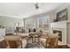 Bright living room featuring a fireplace, large windows, and elegant decor at 1921 Harrison Park Dr, Atlanta, GA 30341