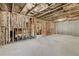 Unfinished basement ready for customization, featuring exposed ceiling beams and concrete flooring at 3286 Sweetleaf Ln, Buford, GA 30519