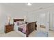 Comfortable bedroom with carpet flooring, featuring a bed, and views into the hallway at 3286 Sweetleaf Ln, Buford, GA 30519