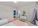 Spacious bedroom featuring two beds, dresser and a partial view of an ensuite bathroom at 3286 Sweetleaf Ln, Buford, GA 30519