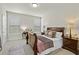 Cozy bedroom with neutral tones, natural light, and a comfortable bed creating a peaceful retreat at 3286 Sweetleaf Ln, Buford, GA 30519