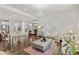 Spacious living room featuring a dining area, hardwood floors, natural light, and access to a patio at 3286 Sweetleaf Ln, Buford, GA 30519