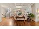 Cozy living room with fireplace, coffered ceiling, and seamless transition to other living spaces and a staircase at 3286 Sweetleaf Ln, Buford, GA 30519