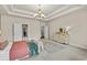 The main bedroom offers a neutral color palette and has views of the ensuite bathroom and walk-in closet at 3286 Sweetleaf Ln, Buford, GA 30519