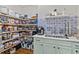 Well-stocked pantry with custom shelving, ample storage, sink and workspace for efficient organization and functionality at 3286 Sweetleaf Ln, Buford, GA 30519