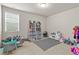 Playroom featuring a play kitchen, table and chairs at 3286 Sweetleaf Ln, Buford, GA 30519