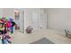 Spacious playroom featuring a costume area and view into an ensuite bathroom at 3286 Sweetleaf Ln, Buford, GA 30519