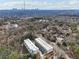 Scenic aerial view of modern townhomes with a backdrop of the city skyline at 1098 Briar Cove Cir, Atlanta, GA 30329