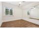 Bedroom featuring wood floors, a window, and a mirrored wall at 1098 Briar Cove Cir, Atlanta, GA 30329