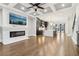 Spacious open-concept layout with fireplace, television, kitchen, island, and staircase at 1098 Briar Cove Cir, Atlanta, GA 30329