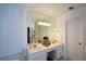 Bright bathroom featuring a large mirror, double vanity, and shuttered window at 1315 Mcgill Park Ne Ave, Atlanta, GA 30312