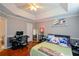 Comfortable bedroom featuring hardwood floors and a computer desk at 1315 Mcgill Park Ne Ave, Atlanta, GA 30312