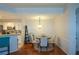 Cozy dining area showcasing hardwood floors, elegant lighting, and a convenient kitchen bar at 1315 Mcgill Park Ne Ave, Atlanta, GA 30312