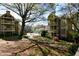 Grounds featuring lush lawn, landscaping, walkways, and multiple apartment buildings at 1315 Mcgill Park Ne Ave, Atlanta, GA 30312