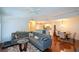 Open living space with hardwood floors and large gray sectional at 1315 Mcgill Park Ne Ave, Atlanta, GA 30312
