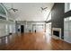This spacious living room with high ceilings and a fireplace is bathed in natural light at 1315 Mcgill Park Ne Ave, Atlanta, GA 30312