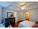 Spacious main bedroom with hardwood floors, a tray ceiling, and convenient access to ensuite at 1315 Mcgill Park Ne Ave, Atlanta, GA 30312