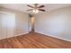 Bedroom with hardwood floors, closet, and fan at 244 Hurt Se Dr, Smyrna, GA 30082