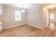Dining room featuring hardwood floors, neutral paint and a modern light fixture at 244 Hurt Se Dr, Smyrna, GA 30082