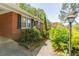 Brick house with manicured bushes in the front yard and a small walkway to the front door at 244 Hurt Se Dr, Smyrna, GA 30082