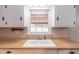 Close up view of the kitchen window and double basin sink with ample counter space at 244 Hurt Se Dr, Smyrna, GA 30082