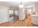 Open living room and kitchen space with stainless appliances and hardwood floors at 244 Hurt Se Dr, Smyrna, GA 30082
