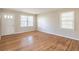 Inviting living room with large windows and hardwood floors; plenty of natural light at 244 Hurt Se Dr, Smyrna, GA 30082