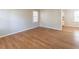 Bright living room featuring gleaming hardwood floors and neutral walls at 244 Hurt Se Dr, Smyrna, GA 30082
