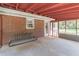 Enclosed sunroom with concrete floors, screens, a porch swing and providing access to the backyard at 244 Hurt Se Dr, Smyrna, GA 30082