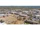 An aerial view of a town showcasing residential and commercial buildings, trees, and landscape at 255 Marjean Way, Alpharetta, GA 30009