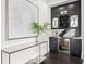 Sophisticated bar area with custom cabinetry, wine storage, and elegant marble countertops at 255 Marjean Way, Alpharetta, GA 30009