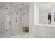 Spa-like bathroom with a large glass shower, dual shower heads, and marble countertops at 255 Marjean Way, Alpharetta, GA 30009
