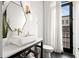 Modern bathroom featuring geometric mirror, designer sink, and natural light at 255 Marjean Way, Alpharetta, GA 30009