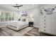 Cozy bedroom showcases a comfortable bed, modern decor, and natural light through shuttered windows at 255 Marjean Way, Alpharetta, GA 30009