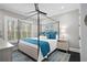 Serene bedroom with a four-poster bed, stylish decor, and abundant natural light through shuttered windows at 255 Marjean Way, Alpharetta, GA 30009