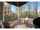 Relaxing outdoor deck featuring comfortable seating, and scenic views of surrounding nature and brick building at 255 Marjean Way, Alpharetta, GA 30009