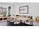 Bright dining area with built-in bench seating, dark floors, and a modern table at 255 Marjean Way, Alpharetta, GA 30009