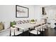 Dining room with a large table, stylish chairs, and a built-in bench with decorative pillows at 255 Marjean Way, Alpharetta, GA 30009