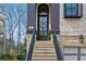 Elegant front door with stone steps and landscaping offering a welcoming entrance at 255 Marjean Way, Alpharetta, GA 30009