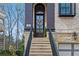 Charming home entrance featuring stone steps and a beautifully decorated front door at 255 Marjean Way, Alpharetta, GA 30009