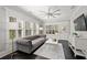 Elegant living room with large windows, refined decor, and dark hardwood floors creating a cozy atmosphere at 255 Marjean Way, Alpharetta, GA 30009
